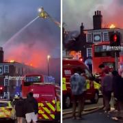 Footage shows fire crews battling to put out a fire that damaged three floors and the roof of a historic Grade II listed derelict pub in Mitcham.