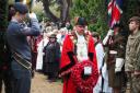 Councillor Robert Foote, Mayor of Epsom, lays a wreath at St Mary's in Ewell. Photo: Brian Angus