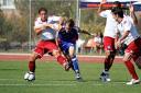 Sam Nicholson playing for Ventura Fusion against Michael Brown and Hayden Mullens from Portsmouth FC in California.