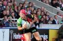 Determined: Quins cente Matt Hopper was up against it in Sunday's war of attrition with Saracens