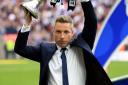 Neil Harris celebrates Millwall's return to the Championship | Picture: PA