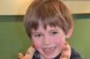 Jago Henderson, six, with a corn snake. Photo: Auriel Glanville