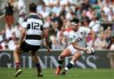 LONDON, ENGLAND - JUNE 02: Marcus Smith of England (L) offloads the ball during the Quilter Cup match between England and Barbarians at Twickenham Stadium on June 02, 2019 in London, England. (Photo by Steve Bardens - RFU/The RFU Collection via Getty