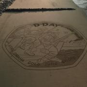 Sand artists recreated the Royal Mint’s D-Day 80 coin design on Gold beach (Royal Mint/PinPep/PA)