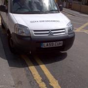 Not only was the traffic warden parking on double yellow lines...
