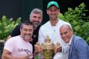 Novak Djokovic and his team, coach Goran Ivanisevic, Edoardo Artaldi, and Ulises Badio, holding the Gentlemen's Singles Trophy
