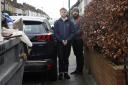 Nat and Matthew Sparkes try and get past a car parked on the pavement on Sandhurst Road, Hither Green (photo: Facundo Arrizabalaga/MyLondon)