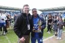 Top man - Colchester United winger Jayden Fevrier is presented with his Hospital Radio Colchester player of the year award by Chris Liddamore