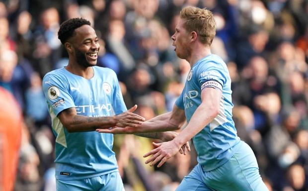 Wimbledon Times: Manchester City's Kevin De Bruyne (right) celebrates with Raheem Sterling after scoring their side's first goal of the game during the Premier League match at Etihad Stadium, Manchester.