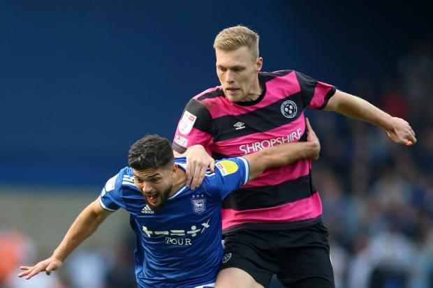Ipswich Town's Sam Morsy (centre) and Shrewsbury Town's Sam Cosgrove battle for the ball during the Sky Bet League One match at Portman Road, Ipswich.