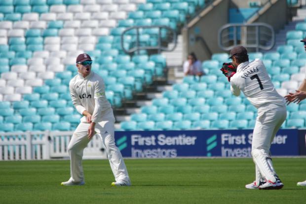 Ben Foakes keeping wicket, with Ollie Pope  Photo: Mark Sandom