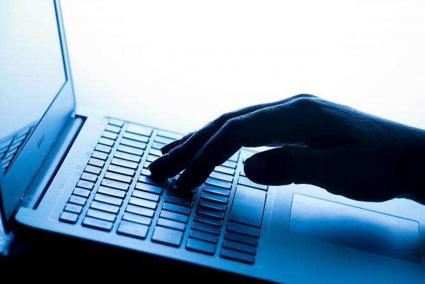 Wimbledon Times: A person typing on a laptop. Credit: PA