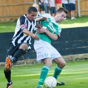 Goal-scorer: Leatherhead's Tom Parkinson does battle with Tooting's Troy Williams    SP73087