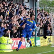 Final day drama: Alan Bennett celebrates the opening goal in Dons vital, final day win over Fleetwood Town               SP73108