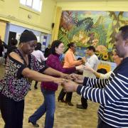 Aspiring ballroom dancers learn new steps at a free class in the Johmard Community Centre