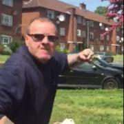 A still shows a man believed to be a Clarion Housing employee threatening a a resident in Wimbledon