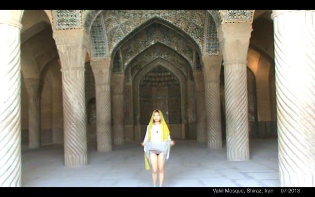 Flashing for freedom: Angela Li Zhenxiang lifts her skirt in an Iranian mosque