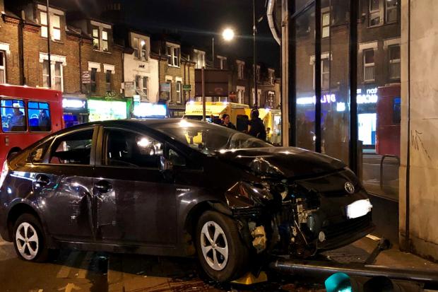 car crashes outside South Wimbledon tube station into a traffic light. Picture credit: Janet Snell